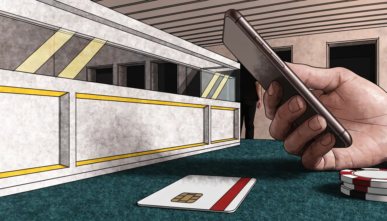 Hand mit Smartphone und Kreditkarte am Casino-Kassentisch